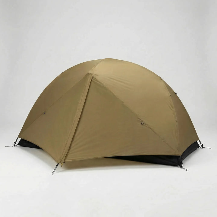 Packed ultralight 1-person tent beside a backpack, showing its compact size for easy solo hiking & camping transport.