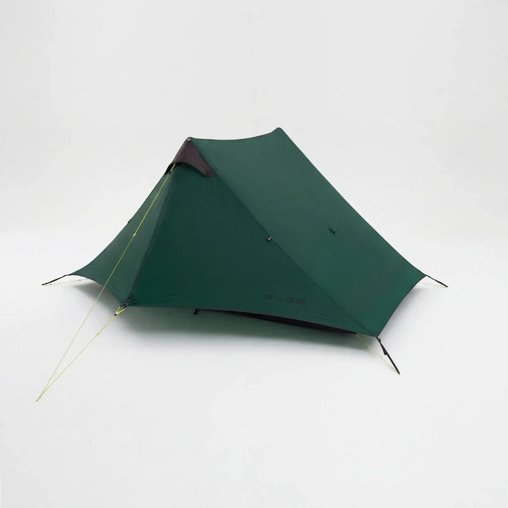 Two backpackers setting up their ultralight 2-person trekking pole tent, ready for a comfortable night's outdoor shelter.