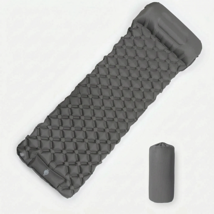 Ultralight camping sleeping pad with built-in foot pump, ideal inflatable gear for backpacking and hiking.