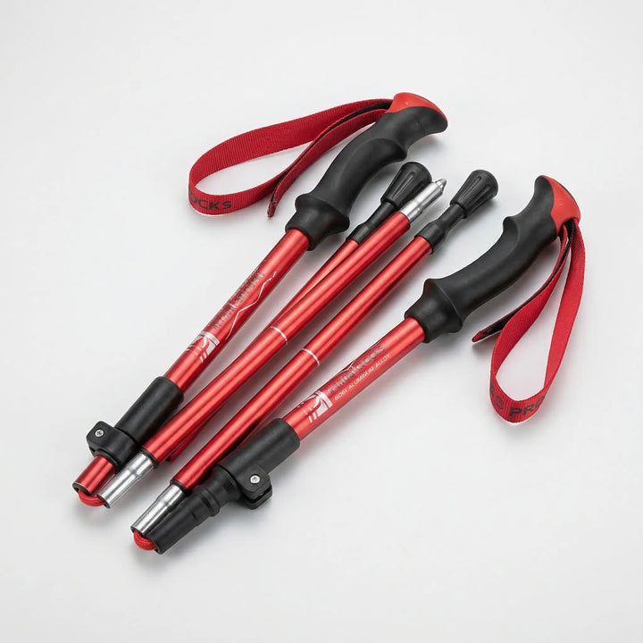 Folding ultralight trekking poles for Nordic & trail walking. Adjustable aluminum design, perfect hiking gear for outdoors.