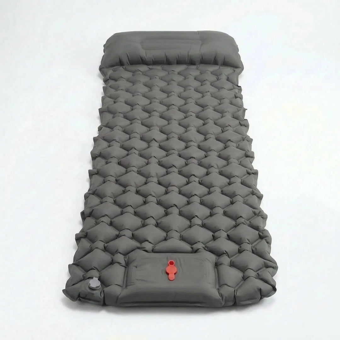 Essential ultralight camp gear: inflatable sleeping pad with integrated pillow for comfortable outdoor use.