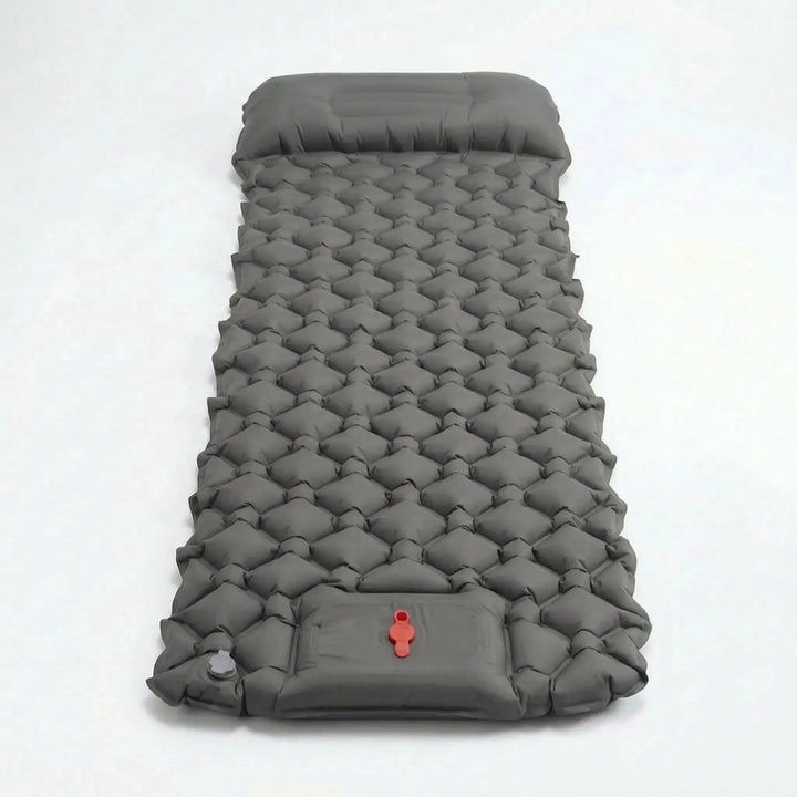 Essential ultralight camp gear: inflatable sleeping pad with integrated pillow for comfortable outdoor use.