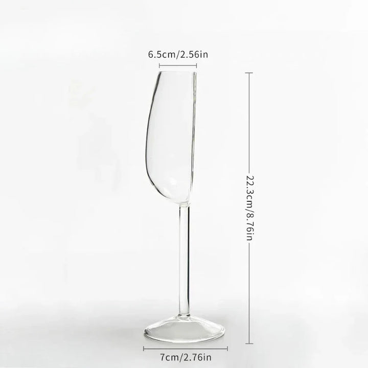 Innovative half-full clear stemmed wine glass, a unique piece of drinkware with sculptural appeal for any table.