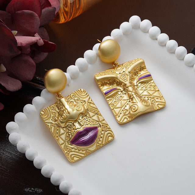 Unique women's asymmetrical retro earrings, gold plated statement jewelry with push-back closure.