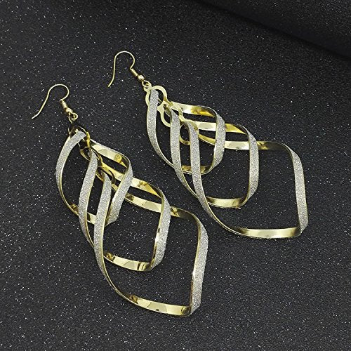 Striking golden spiral statement earrings. Unique women's dangle jewelry that adds elegance.