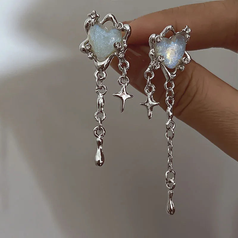 Unique women's irregular heart, star, and tassel sterling silver earrings. Perfect statement jewelry.