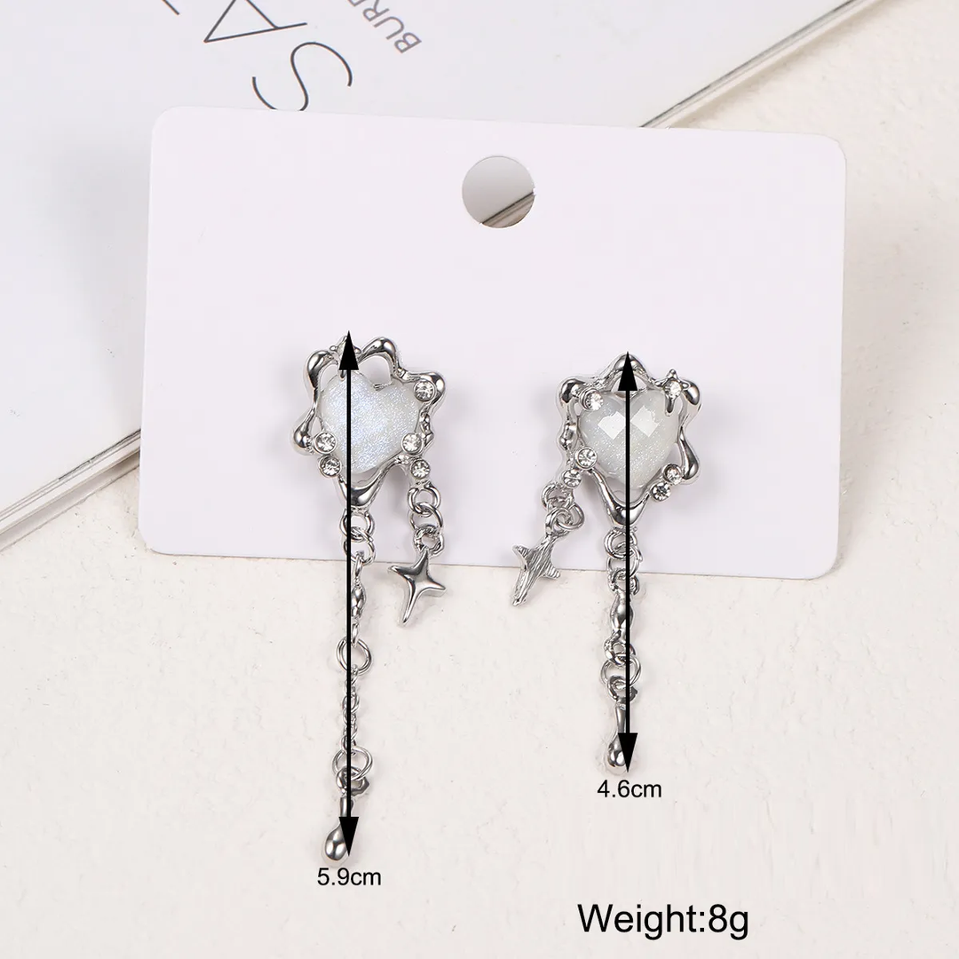 Elegant women's unique irregular heart, star, and tassel earrings. Fashionable sterling silver jewelry.