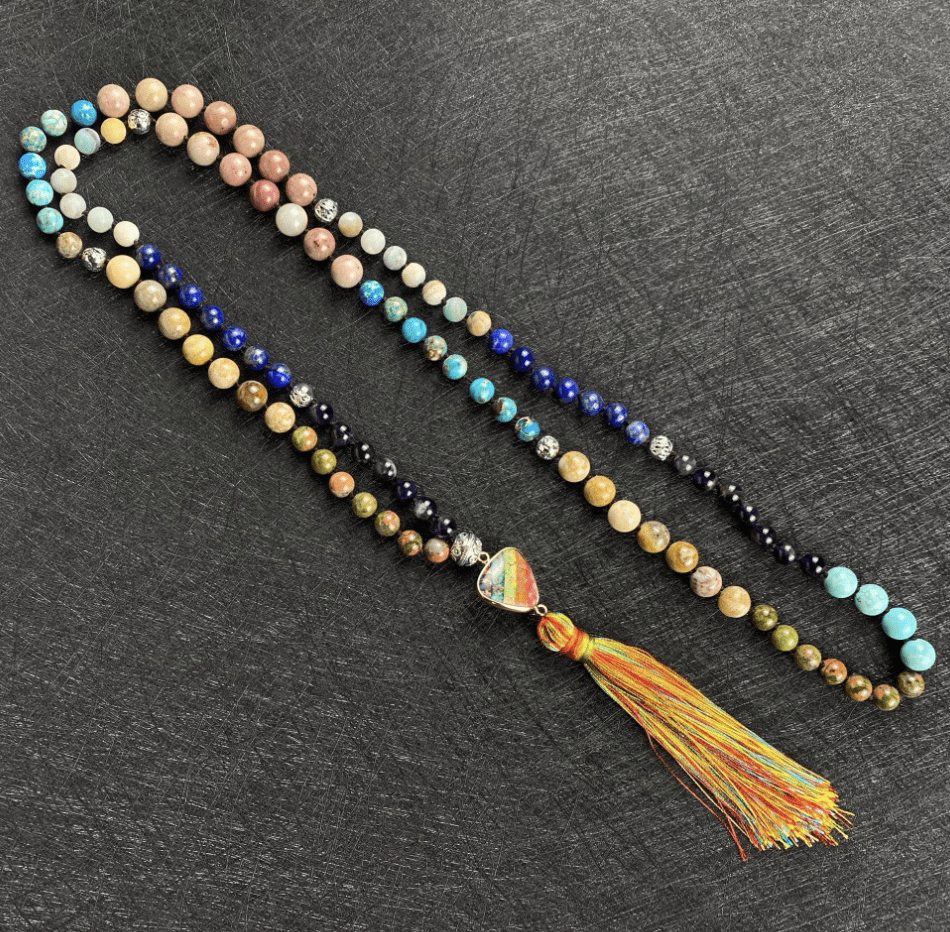 Spiritual mala necklace featuring genuine gemstones, for meditation & positive energy flow.