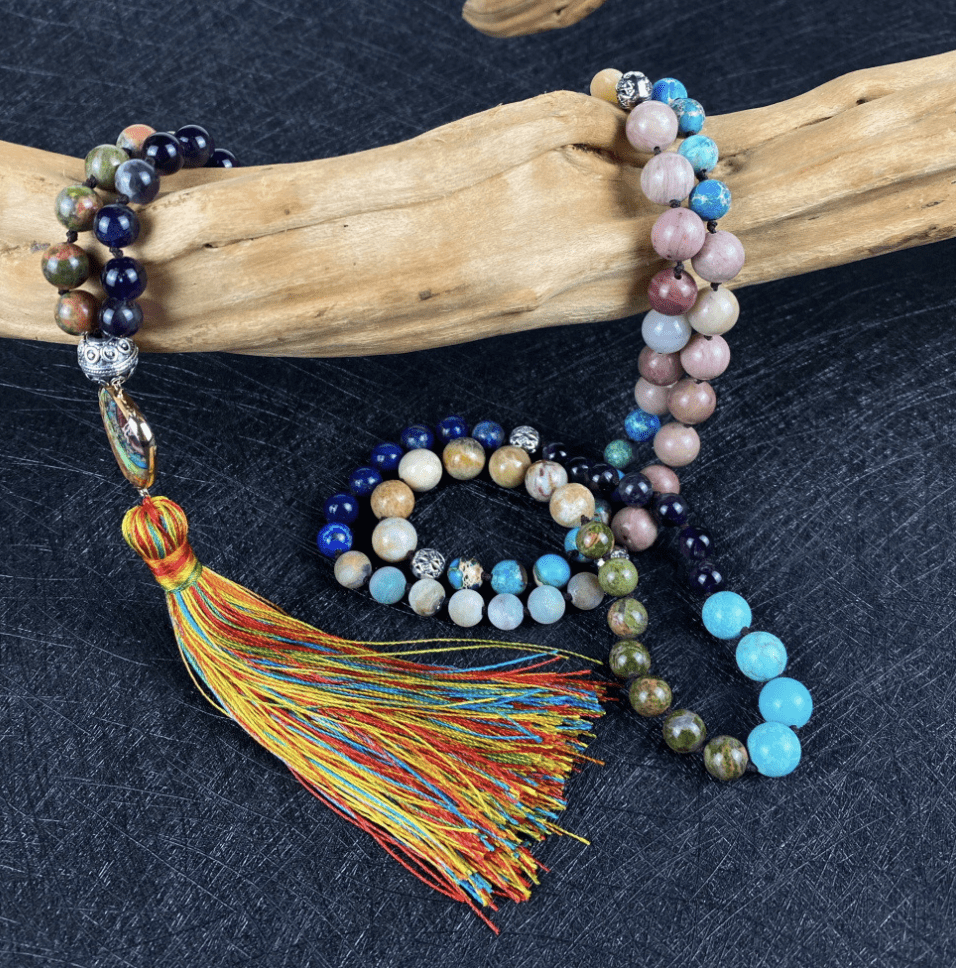 Altheira enlightenment mala necklace with polished gemstones, enhancing spiritual journey.