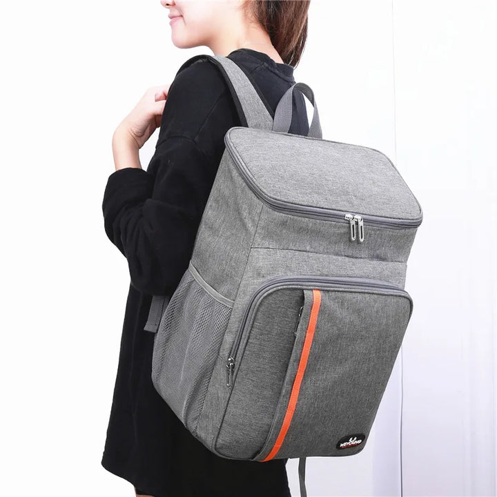 Side view of ChillPack portable cooler backpack, showing mesh pocket for water bottle or accessories
