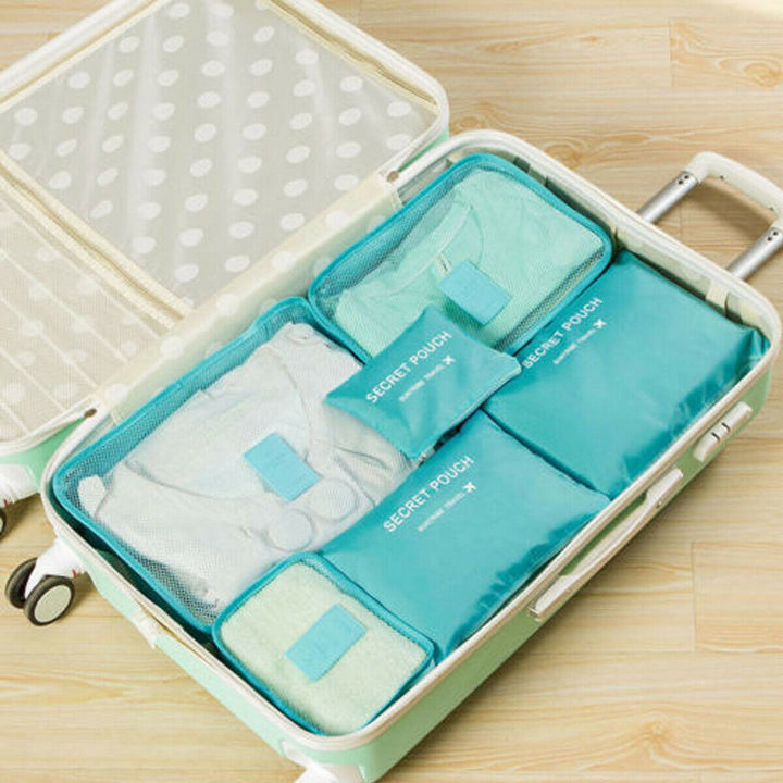 Two black packing cubes side-by-side, ready for travel packing