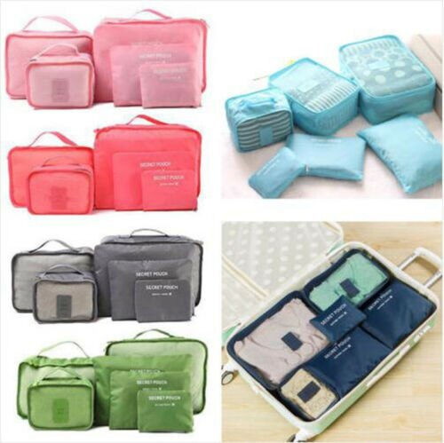 Stack of two packing cubes neatly fitting into a suitcase, travel accessories
