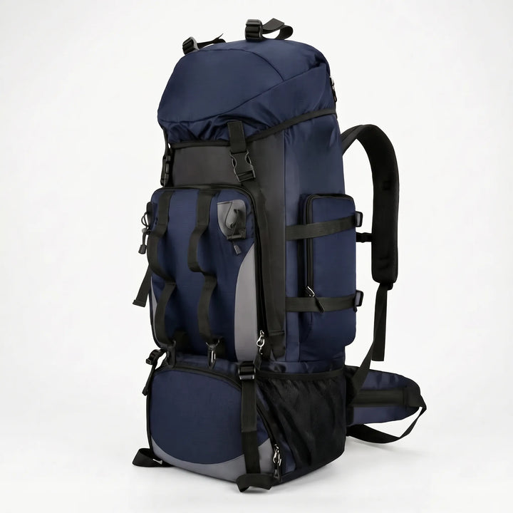 Unisex 24gal large hiking backpack resting on a trail, ready for an extended camping or outdoor adventure trip.