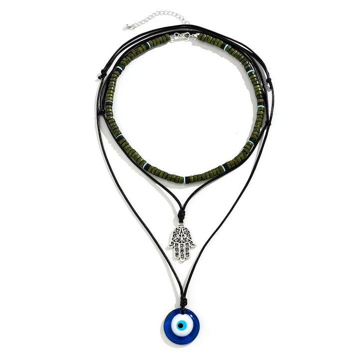 Unisex 3-layer necklace set with symbolic evil eye, Hamsa hand charm, and pearl pendants.