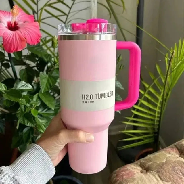 Unisex 40 fl oz vacuum insulated tumbler with lid & straw for hot or cold beverages.