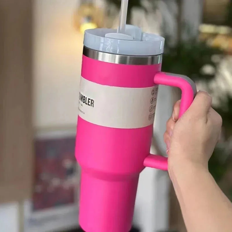 Stainless steel 40oz travel mug with straw lid, perfect for keeping drinks hot/cold.