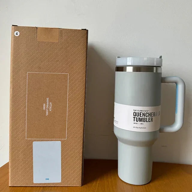 Modern 40 fl oz vacuum insulated drinkware, straw & lid, for hot/cold beverages.