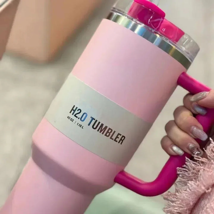 Portable 40 fl oz vacuum insulated tumbler for hydration on the go; includes lid & straw.