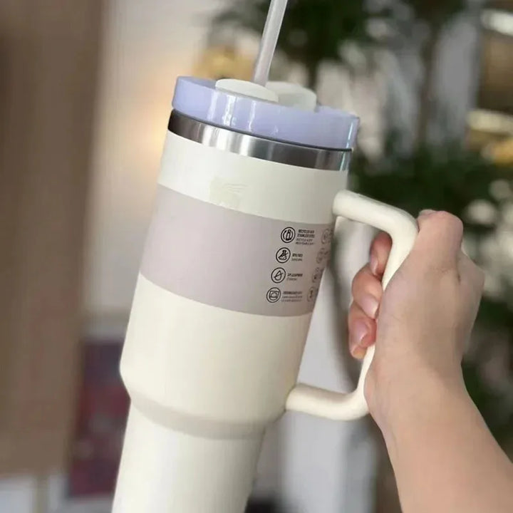 Durable 40 fl oz stainless steel vacuum tumbler with straw lid, keeps drinks hot/cold.