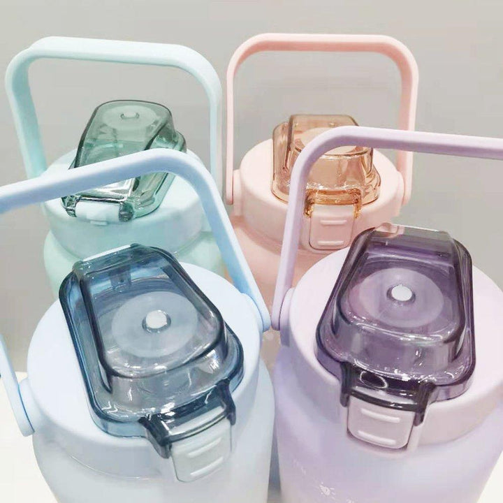 Motivational 64 fl oz sports water bottle, leak-proof with time markers for tracking daily hydration.