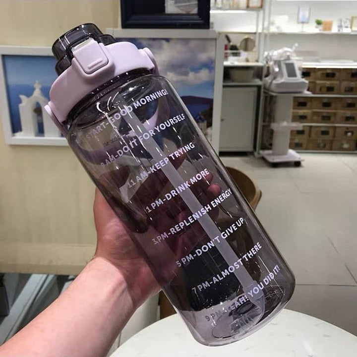Stay hydrated with this 64 oz unisex motivational water bottle, designed with helpful time markers.