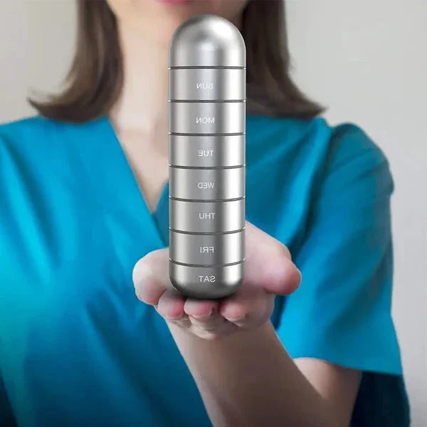 Unisex 7-day portable aluminum pill box, secure for medication & supplements.