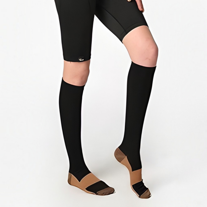 Copper compression socks for swelling relief, leg support, and comfort during travel, standing, or active recovery. Unisex.