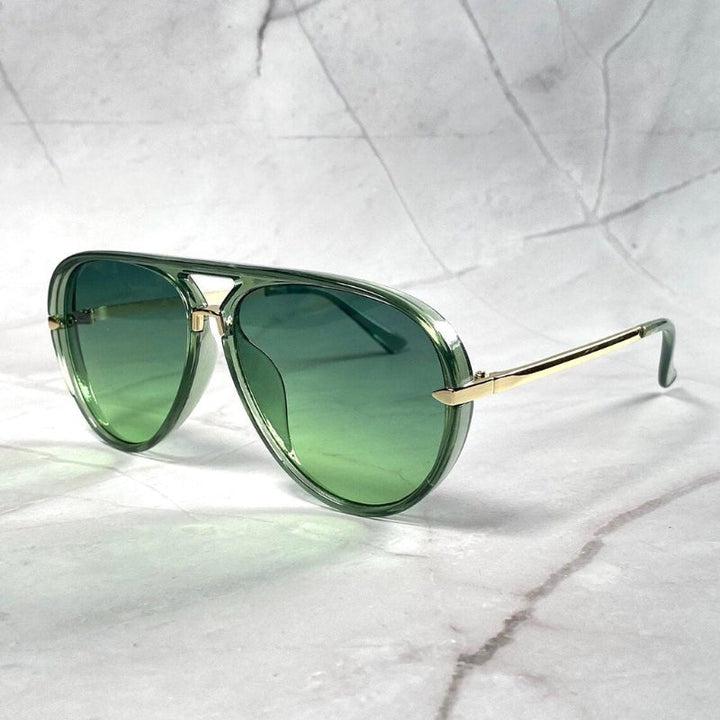 Unisex '70s aviator sunglasses with stylish brown gradient lenses; retro UV protection eyewear.