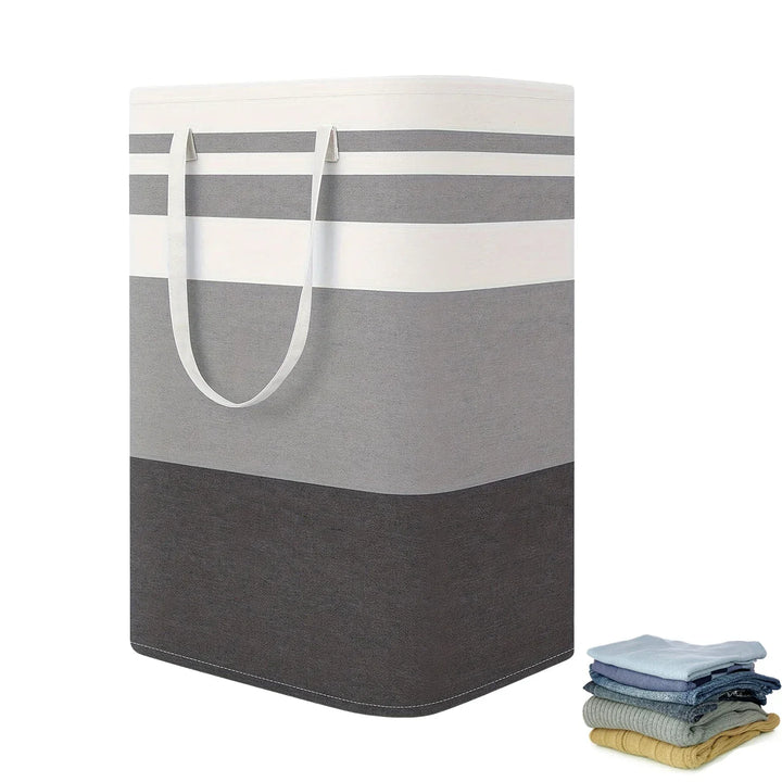 Unisex 75L large striped laundry hamper with handles, collapsed, showing space-saving design in a modern home setting
