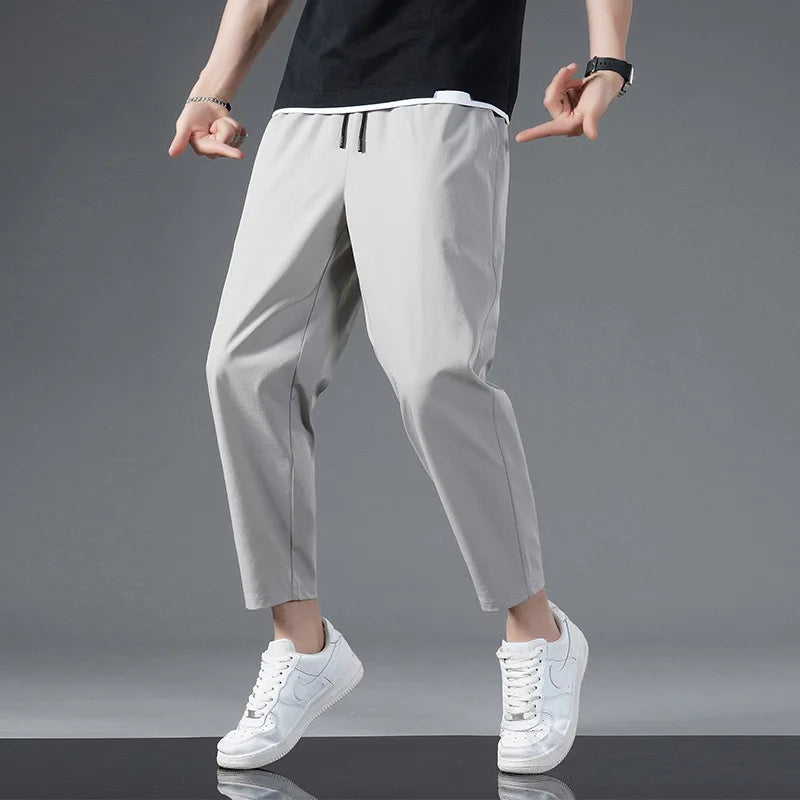 Moisture-wicking unisex performance pants. Stretchy, lightweight athletic pants designed for gym, fitness & daily wear.