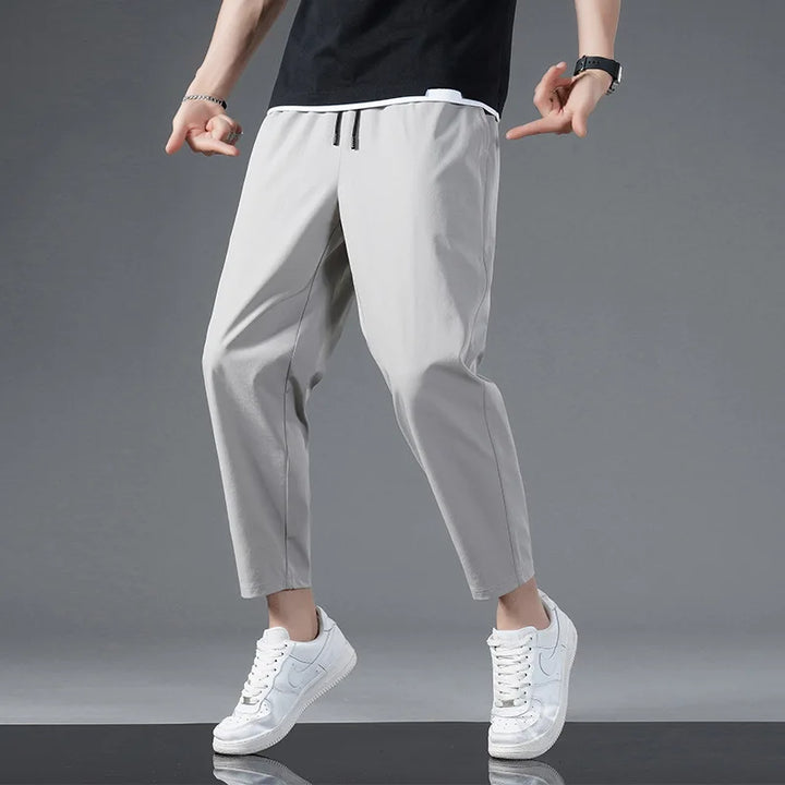 Moisture-wicking unisex performance pants. Stretchy, lightweight athletic pants designed for gym, fitness & daily wear.