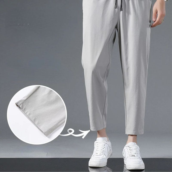 Model wearing unisex active workout pants. Lightweight, stretchy fitness apparel for high-performance training & movement.