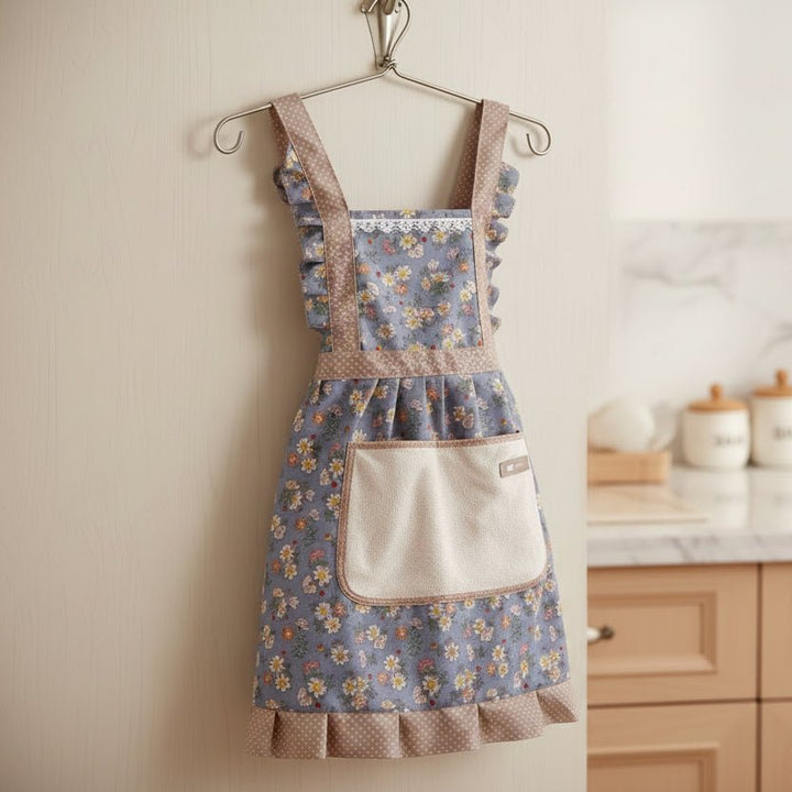 Blue floral unisex kitchen apron, adjustable and perfect for home cooks.