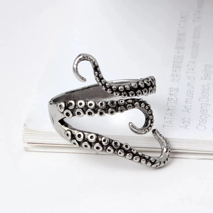 Ocean-inspired adjustable silver tentacle ring. Unisex statement piece with unique Nautilus design & antique finish.
