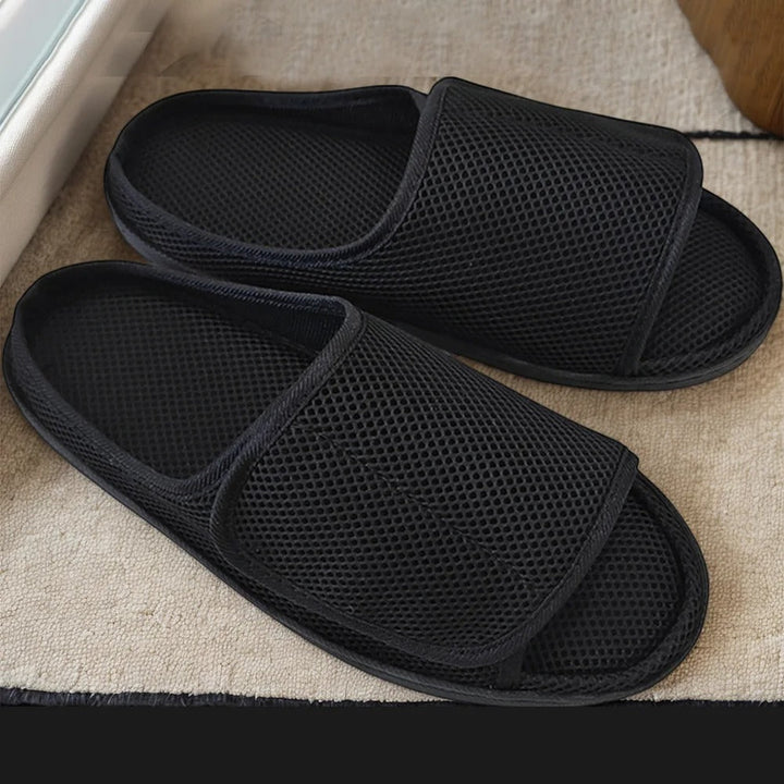 Adjustable comfort slippers for swollen or diabetic feet. Unisex wide fit house shoes with easy hook & loop closure for mobility.