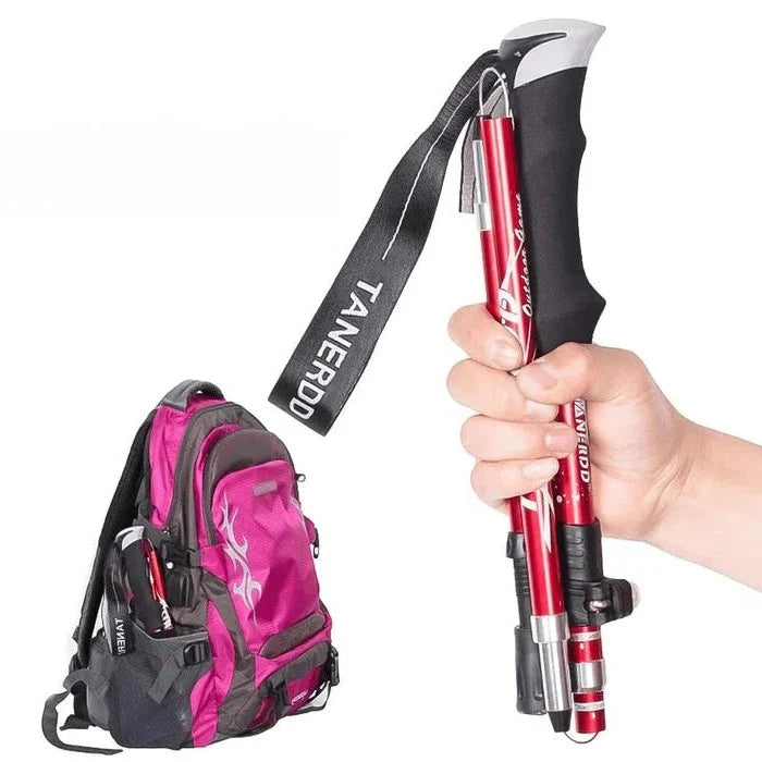 Compact foldable trekking poles, adjustable & lightweight. Essential hiking gear for outdoor adventures & reliable trail support.