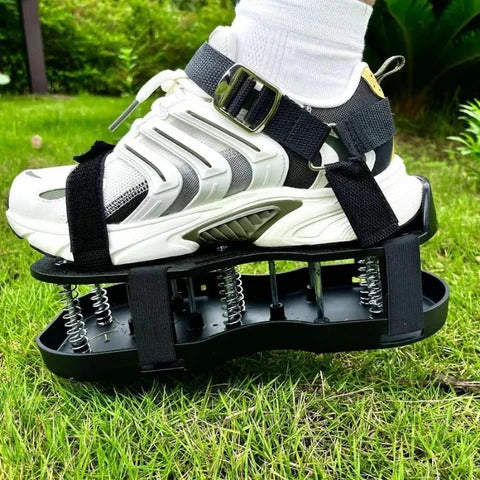 Gardener wearing unisex aerator lawn shoes, walking on grass, improving soil aeration for thriving, healthy lawn & root health.