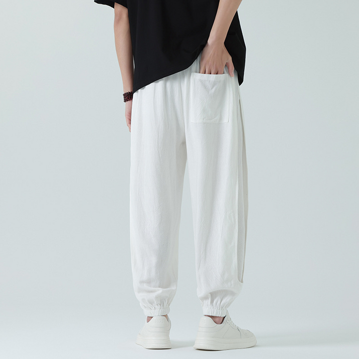 Model wearing relaxed fit unisex Airdrifter joggers. Lightweight & comfortable for everyday casual or active use.