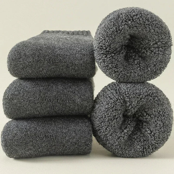 Three pairs of cozy Alpine Warm thermal winter socks for unisex, providing comfort & warmth in a convenient 3-pack.