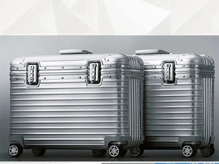 Ergonomic telescopic handle extended on a unisex aluminum-magnesium hardshell carry-on suitcase, easy grip.