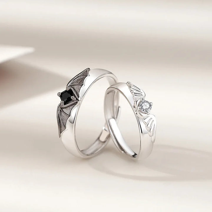 Close-up of a unique Angel and Demon couple ring set with sparkling crystals. Nontarnish, adjustable rings.