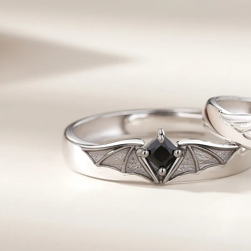 Symbolic unisex Angel and Demon rings, perfect for couples. Adjustable design with clear crystals; nontarnish finish.