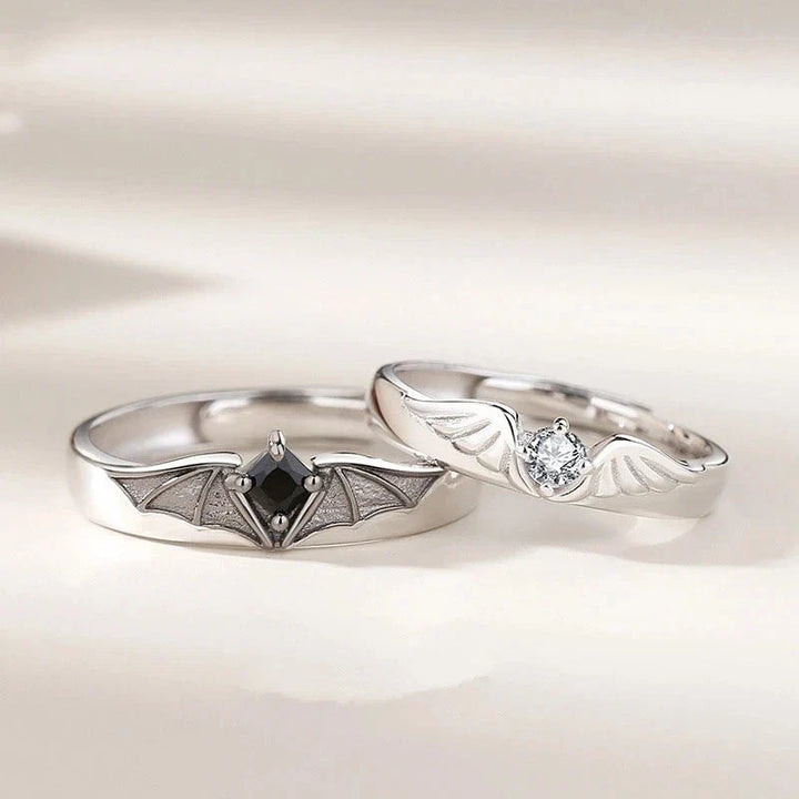 Detailed view of the unique Angel and Demon motif on the nontarnish couple rings, featuring subtle crystal elements.