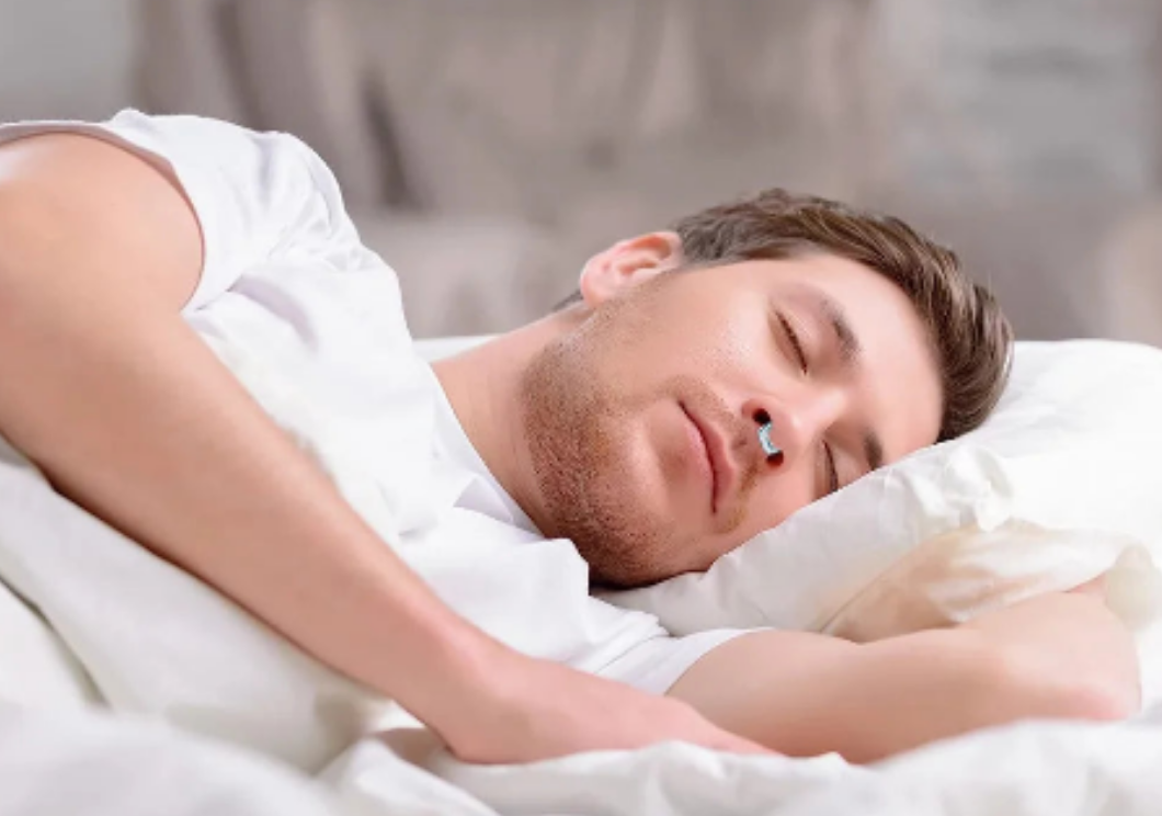 Unisex anti-snore nose clip for silent, restful sleep. Comfortable & reusable snoring relief device.