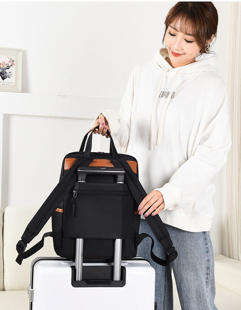 Image showing the capacity of the unisex Oxford travel backpack, filled with travel essentials.