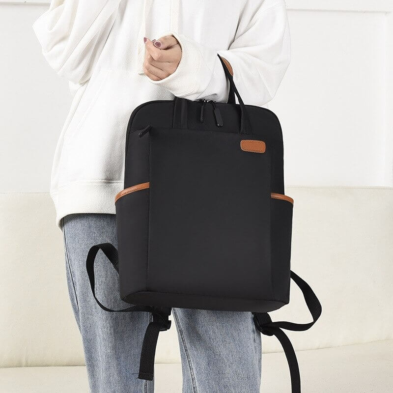 Side view: Slim profile unisex anti-theft backpack, water-resistant & lightweight for daily commute.
