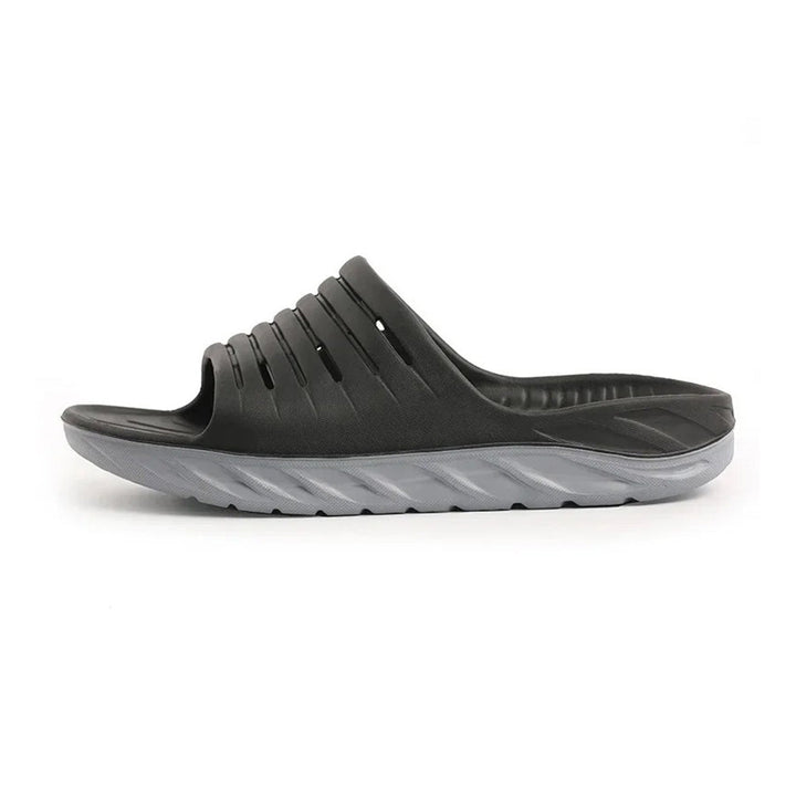 Unisex arch support slides providing foot pain relief and comfort. Ideal recovery footwear for daily wear.