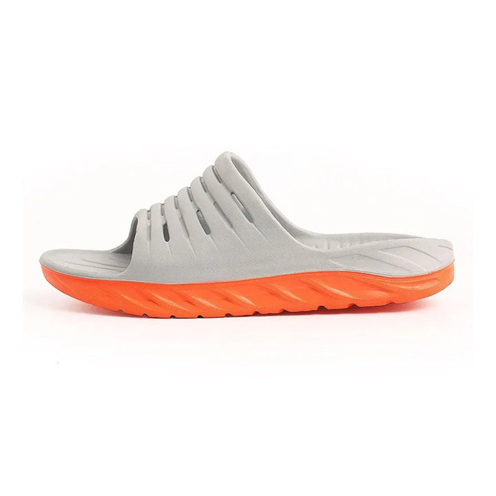 Unisex arch support slides designed for plantar fasciitis & foot pain relief. Comfortable ergonomic footwear.