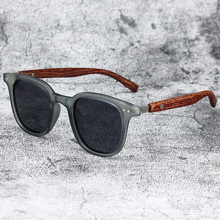 Arden sunglasses featuring translucent wood grain frames, providing excellent UV protection & glare reduction.
