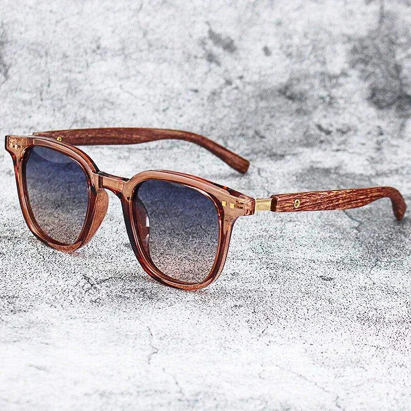 Fashionable Arden sunglasses. Unisex design with translucent frames & subtle wood grain, offering UV protection.
